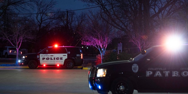 Police cars remain parked at Good Shepherd Catholic Community church on Jan. 15, 2022 in Colleyville, Texas.