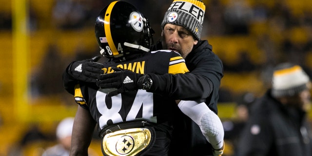 Pittsburgh Steelers Wide Receiver Antonio Brown (84) hugs Pittsburgh Steelers Offensive Coordinator Todd Haley during the game between the Baltimore Ravens and the Pittsburgh Steelers on December 10, 2017 at Heinz Field in Pittsburgh.