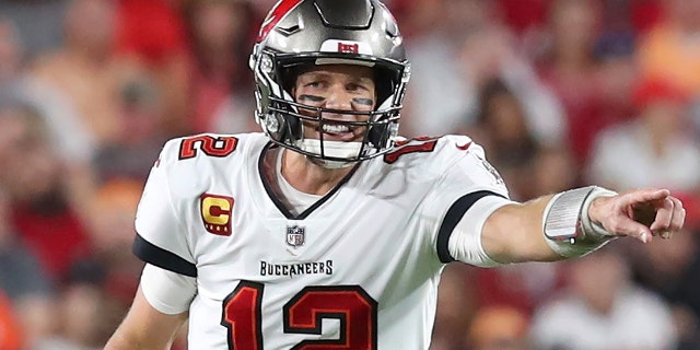Tom Brady points during the Jan. 9, 2022, game against the Carolina Panthers at Raymond James Stadium in Tampa, Florida.