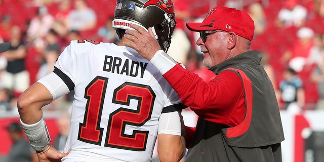  Tampa Bay Buccaneers Quarterback Tom Brady (12) greets Head Coach Bruce Arians before the regular season game between the Carolina Panthers and the Tampa Bay Buccaneers on January 9, 2022 at Raymond James Stadium in Tampa, Florida.