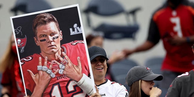 Tom Brady fans during warmup before the Tampa Bay Buccaneers' game against the Los Angeles Rams at SoFi Stadium on Sept. 26, 2021, in Inglewood, California.
