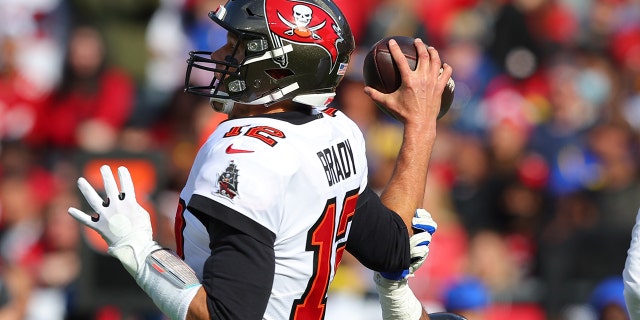Tom Brady of the Tampa Bay Buccaneers looks to throw in the first quarter against the Los Angeles Rams in the NFC Divisional Playoff game at Raymond James Stadium Jan. 23, 2022, in Tampa, Fla.