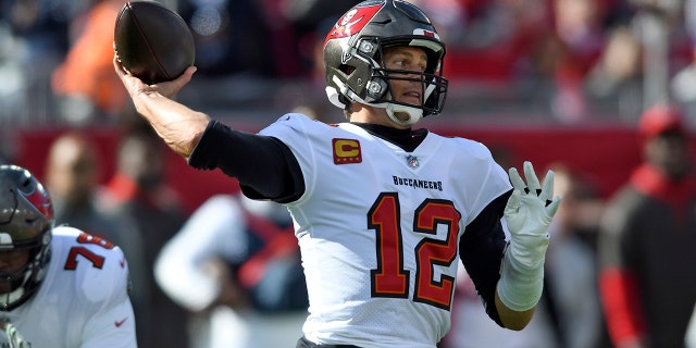 Tampa Bay Buccaneers quarterback Tom Brady (12) throws a pass during the first half of an NFL divisional round playoff football game against the Los Angeles Rams Sunday, Jan. 23, 2022, in Tampa, Fla.