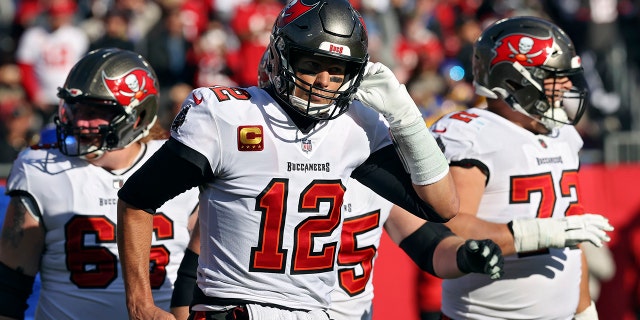 Tampa Bay Buccaneers quarterback Tom Brady (12) walks off after a drive stalled against the Los Angeles Rams during the first half of an NFL divisional round playoff football game Sunday, Jan. 23, 2022, in Tampa, Fla.