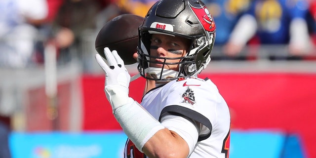 Tampa Bay Buccaneers quarterback Tom Brady warms up before the NFC Divisional game between the Los Angeles Rams and the Tampa Bay Buccaneers on Jan. 23, 2022, at Raymond James Stadium in Tampa, Florida.