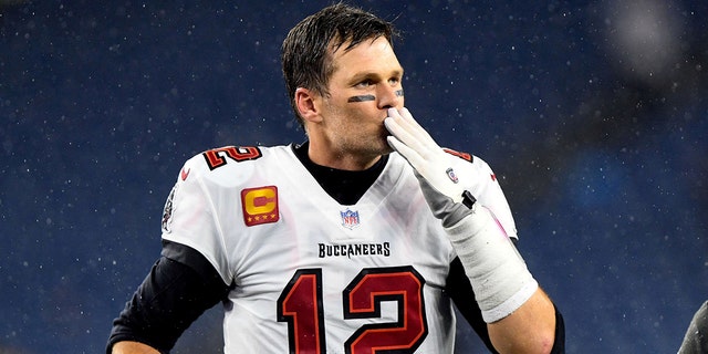 Tampa Bay Buccaneers quarterback Tom Brady, #12, blows a kiss to fans after a game against the New England Patriots at Gillette Stadium in Foxborough, Massachusetts, Oct. 3, 2021.