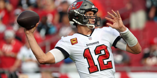 Tom Brady of the Tampa Bay Buccaneers warms up prior to a game against the Carolina Panthers at Raymond James Stadium Jan. 9, 2022, in Tampa, Fla.