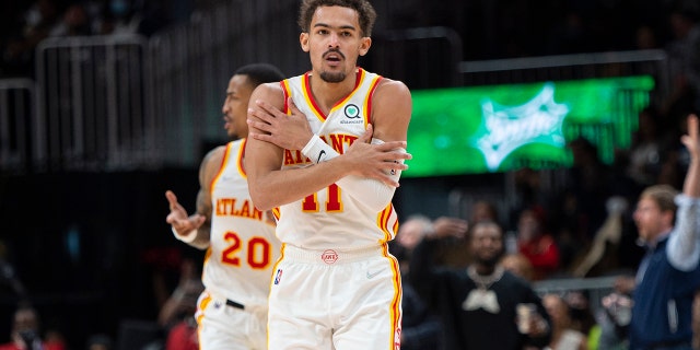 Atlanta Hawks guard Trae Young (11) reacts after making a 3-pointer during the second half of the team's NBA basketball game against the Minnesota Timberwolves on Wednesday, Jan. 19, 2022, in Atlanta.