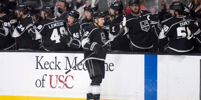 Los Angeles Kings center Trevor Moore (12) is congratulated for his goal during the first period of the team's NHL hockey game against the Philadelphia Flyers on Saturday, Jan. 1, 2022, in Los Angeles.