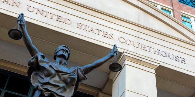 The U.S. Courthouse in Alexandria, Va., Sept. 2, 2021. A woman who once lived in Kansas has been arrested after federal prosecutors charged her with joining the Islamic State group and leading an all-female battalion of AK-47-wielding militants. The U.S. Attorney in Alexandria announced Saturday, Jan. 29, 2022, that 42-year-old Allison Fluke-Ekren has been charged with providing material support to a terrorist organization.  