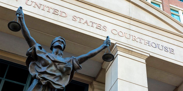 The U.S. Courthouse in Alexandria, Va., Sept. 2, 2021. A woman who once lived in Kansas has been arrested after federal prosecutors charged her with joining the Islamic State group and leading an all-female battalion of AK-47-wielding militants. The U.S. Attorney in Alexandria announced Saturday, Jan. 29, 2022, that 42-year-old Allison Fluke-Ekren has been charged with providing material support to a terrorist organization.