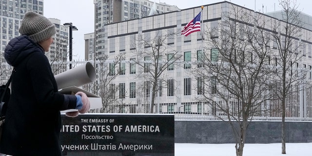 A woman walks past the U.S. Embassy in Kyiv, Ukraine, Jan. 24.