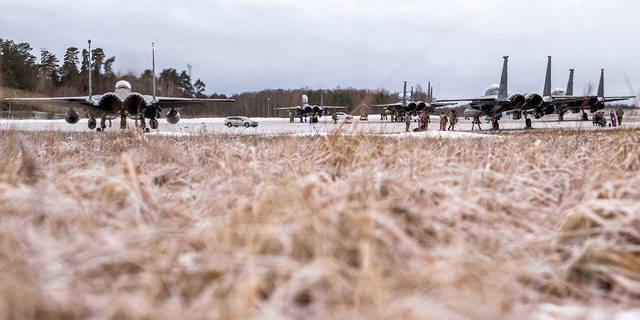 Six F-15E Strike Eagles, assigned to the 4th Fighter Wing from Seymour Johnson Air Force Base in N.C., receive routine maintenance after arriving at Ämari Air Base, Estonia, Jan. 26, 2022. 