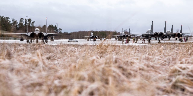 Six F-15E Strike Eagles, assigned to the 4th Fighter Wing from Seymour Johnson Air Force Base in N.C., receive routine maintenance after arriving at Ämari Air Base, Estonia, Jan. 26, 2022.