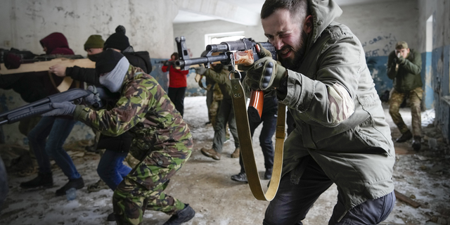 Local residents train close to Kyiv, Ukraine, on Sunday.