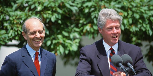 Then-U.S. Court of Appeals Chief Judge Stephen Breyer, left, listens as President Clinton names Breyer a Supreme Court associate justice during a news conference outside the White House, May 13, 1994.