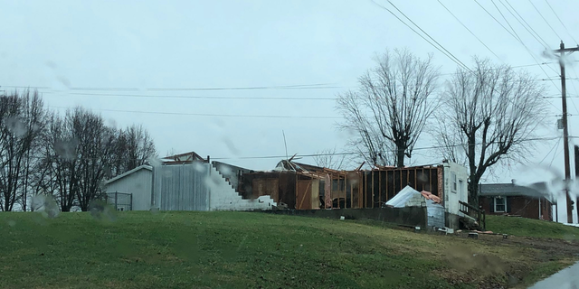 A house appears with significant damage in Campbellsville, Kentucky after a tornado warned storm went through the area. (Credit: Ethan Bailey)