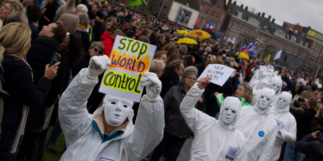 Several thousands of people defied a ban Sunday to gather and protest the Dutch government's coronavirus lockdown measures, in Amsterdam, Netherlands, Sunday, Jan. 2, 2022. (AP Photo/Peter Dejong)