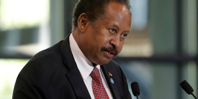 FILE - Sudanese Prime Minister Abdalla Hamdok speaks during a session of the summit to support Sudan, at the Grand Palais Ephemere in Paris on May 17, 2021.