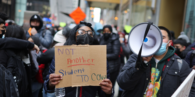 Public school students protest outside of the Chicago Public Schools headquarters after walking out of their classrooms on January 14, 2022 in Chicago, Illinois. (Photo by Scott Olson/Getty Images)