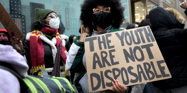 Public school students protest outside of the Chicago Public Schools headquarters after walking out of their classrooms on January 14, 2022 in Chicago, Illinois. (Photo by Scott Olson/Getty Images)