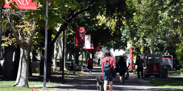 A UNLV student walks on campus after attending a class at UNLV amid the spread of the coronavirus in September 2020 in Las Vegas.