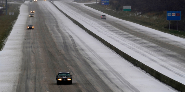 Drivers navigate hazardous conditions on Interstate 85/40 as a winster storm moves through the area in Mebane, N.C., Sunday, Jan. 16, 2022. (AP Photo/Gerry Broome)