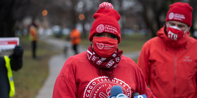 Former teacher Tara Stamps speaks ahead of a car caravan where teachers and supporters gathered to demand a safe and equitable return to in-person learning during the COVID-19 pandemic in Chicago, IL on December 12, 2020. (Photo by Max Herman/NurPhoto via Getty Images)