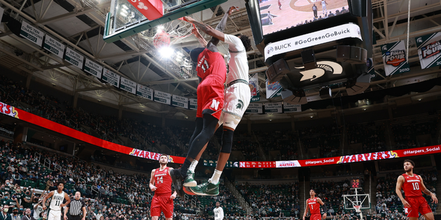 Marcus Bingham Jr. #30 of the Michigan State Spartans dunks the ball over Lat Mayen #11 of the Nebraska Cornhuskers in the first half at Breslin Center on January 5, 2022 in East Lansing, Michigan.