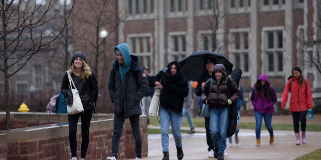  Students walk through campus at Washington University in St. Louis, MO on Wednesday, February 12, 2020.