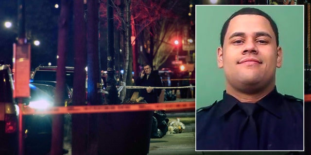 A general view shows the taped off area marking the scene of a shooting in Harlem, New York on January 22, 2022. - New York's mayor called on the federal government to help "stop the flow of weapons" in the city after a police officer was killed and another wounded in a shooting.