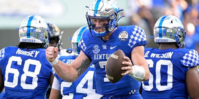 Kentucky quarterback Will Levis (7) celebrates after taking the final snap of the Citrus Bowl NCAA college football game win against Iowa, Saturday, Jan. 1, 2022, in Orlando, Fla.