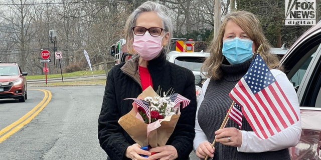 Members of the local American Legion Auxiliary lined up in their cars for the procession to honor WWII veteran Stanley Tauber on Dec. 31, 2021.