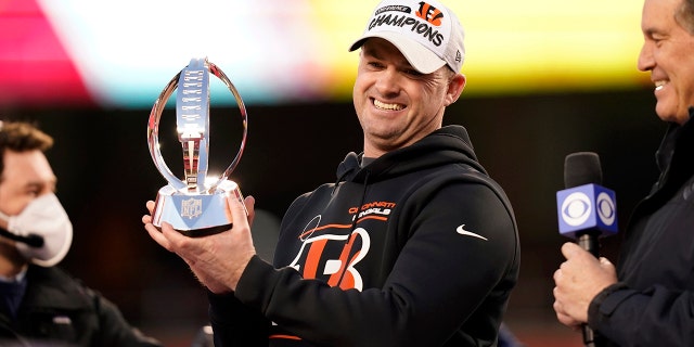 Cincinnati Bengals head coach Zac Taylor holds the Lamar Hunt trophy after the AFC championship game against the Chiefs, Sunday, Jan. 30, 2022, in Kansas City, Missouri.