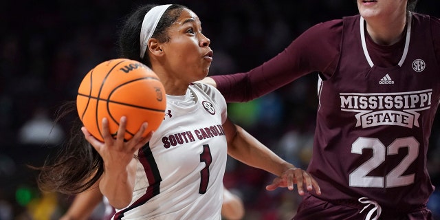South Carolina guard Zia Cooke (1) drives to the hoop against Mississippi State center Charlotte Kohl (22) during the first half of an NCAA college basketball game Sunday, Jan. 2, 2022, in Columbia, S.C.
