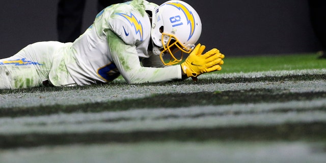 Los Angeles Chargers wide receiver Mike Williams (81) reacts after missing an attempted touchdown catch against the Las Vegas Raiders during overtime of an NFL football game, Sunday, Jan. 9, 2022, in Las Vegas.