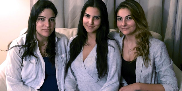 Three of Amer Fakhoury's four daughters, from left, Guila, Macy and Zoya, Fakhoury, gather Nov. 5, 2019, in Salem, New Hampshire. 