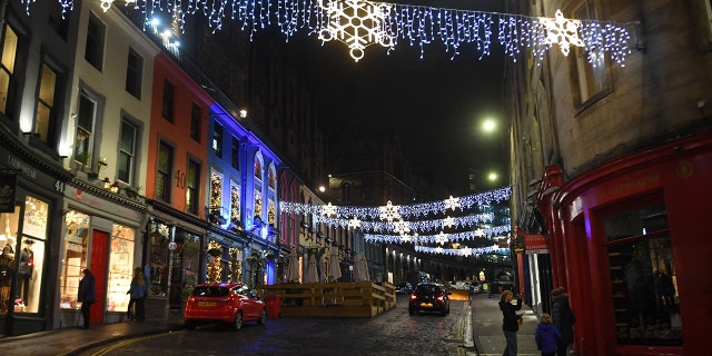A near-deserted Victoria Street in the center of Edinburgh on New Year's Eve, Dec. 31, 2021, as large-scale Hogmanay celebrations were canceled for the second year running in the city.