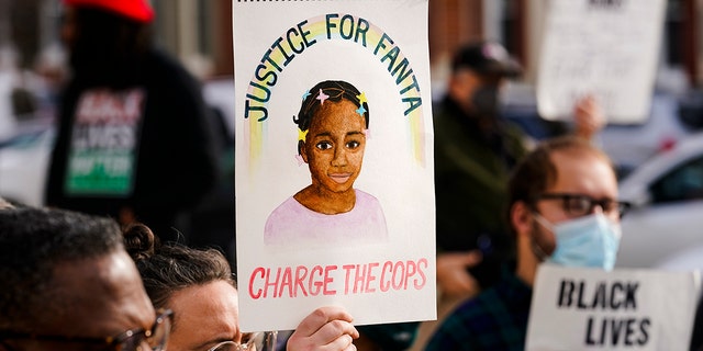 Protesters demonstrate calling for police accountability in the death of 8-year-old Fanta Bility who was shot outside a football game, at the Delaware County Courthouse in Media, Pa., Thursday, Jan. 13, 2022. Authorities say officers were responding to gunfire between two teens when Bility was fatally struck by a police bullet in 2021.