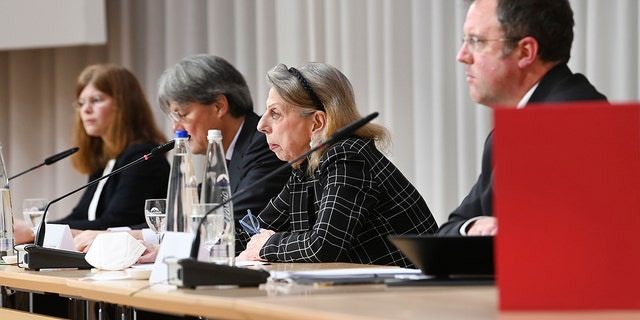 Barbara Leyendecker, Ulrich Wastl, Marion Westpfahl and Martin Pusch, from left, from the Munich law firm Westpfahl Spilker Wastl at the presentation of the expert report on cases of sexual abuse in the Catholic Archdiocese of Munich and Freising in Munich, Germany, Thursday, Jan. 20, 2022. The diocese of Munich had commissioned the law firm with the expert opinion on the abuse cases.