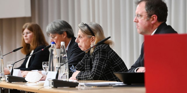 Barbara Leyendecker, Ulrich Wastl, Marion Westpfahl and Martin Pusch, from left, from the Munich law firm Westpfahl Spilker Wastl at the presentation of the expert report on cases of sexual abuse in the Catholic Archdiocese of Munich and Freising in Munich, Germany, Thursday, Jan. 20, 2022. The diocese of Munich had commissioned the law firm with the expert opinion on the abuse cases.