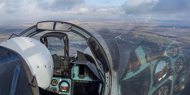 A view from the cockpit of a Russian Su-30 fighter jet as it takes part in a training mission in Krasnodar Region, Russia, Wednesday, Jan. 19, 2022. 