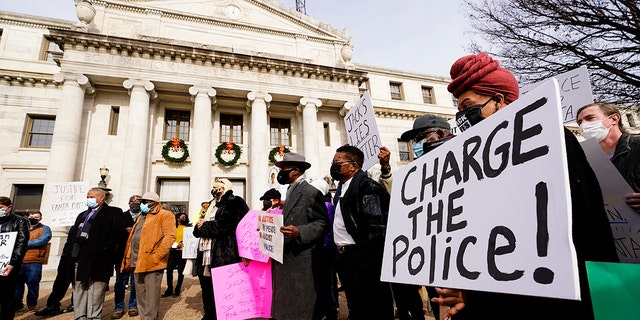 Protesters demonstrate calling for police accountability in the death of 8-year-old Fanta Bility who was shot outside a football game, at the Delaware County Courthouse in Media, Pa., Thursday, Jan. 13, 2022. 