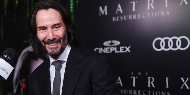 Actor Keanu Reeves attends the Canadian Premiere of "The Matrix Resurrections" held at Cineplex's Scotiabank Theatre on December 16, 2021 in Toronto, Ontario. The actor is reportedly charitable.