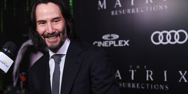 Actor Keanu Reeves attends the Canadian Premiere of "The Matrix Resurrections" held at Cineplex's Scotiabank Theatre on December 16, 2021 in Toronto, Ontario. The actor is reportedly charitable.