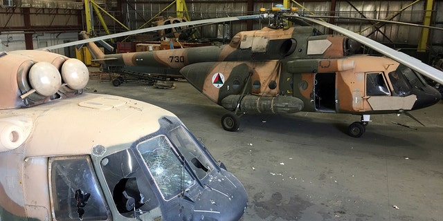 Damaged Afghan military helicopters are parked inside the Hamid Karzai International Airport after the Taliban's takeover, in Kabul, Afghanistan, Sept. 5, 2021.