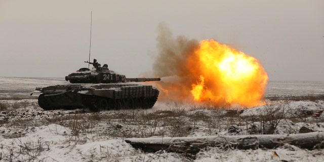 A Russian tank T-72B3 fires as troops take part in drills at the Kadamovskiy firing range in the Rostov region in southern Russia, on Jan. 12, 2022.