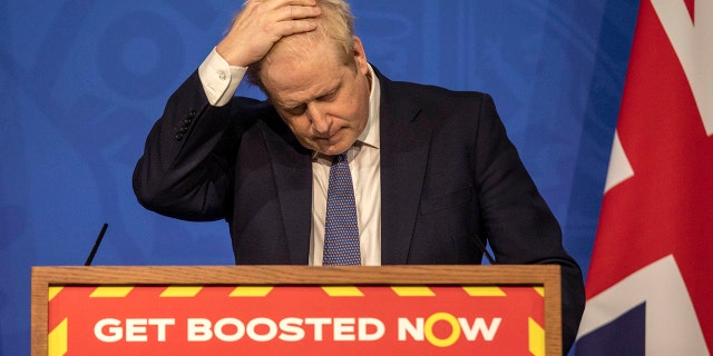 FILE - Britain's Prime Minister Boris Johnson gestures during a coronavirus media briefing in Downing Street, London, on Jan. 4, 2022. For Boris Johnson, facts have always been flexible. The British prime minister’s career is littered with doctored quotes, tall tales, exaggerations and mistruths. When called out, he has generally offered an apologetic shrug or a guilty grin, and moved on. At least until now. Revelations that the prime minister and his staff partied while Britain was under coronavirus restrictions has provoked public outrage. (Jack Hill, Pool Photo via AP, File)