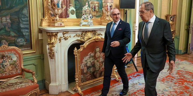 Russia Foreign Minister Sergey Lavrov, right, and Croatia Foreign Minister Gordan Grlic Radman walk together ahead of their talks in Moscow, Russia, Jan. 17, 2022. 