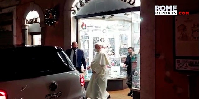 In this image from video made available by Javier Martinez Brocal of Rome Reports, Pope Francis leaves a record shop in Rome, Tuesday, Jan. 11, 2022. 